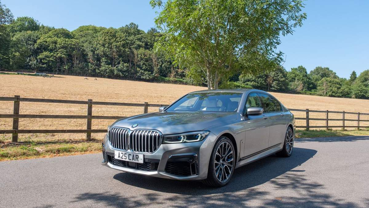 A25 Cars BMW 7 Series executive saloon on A25 corridor country lane